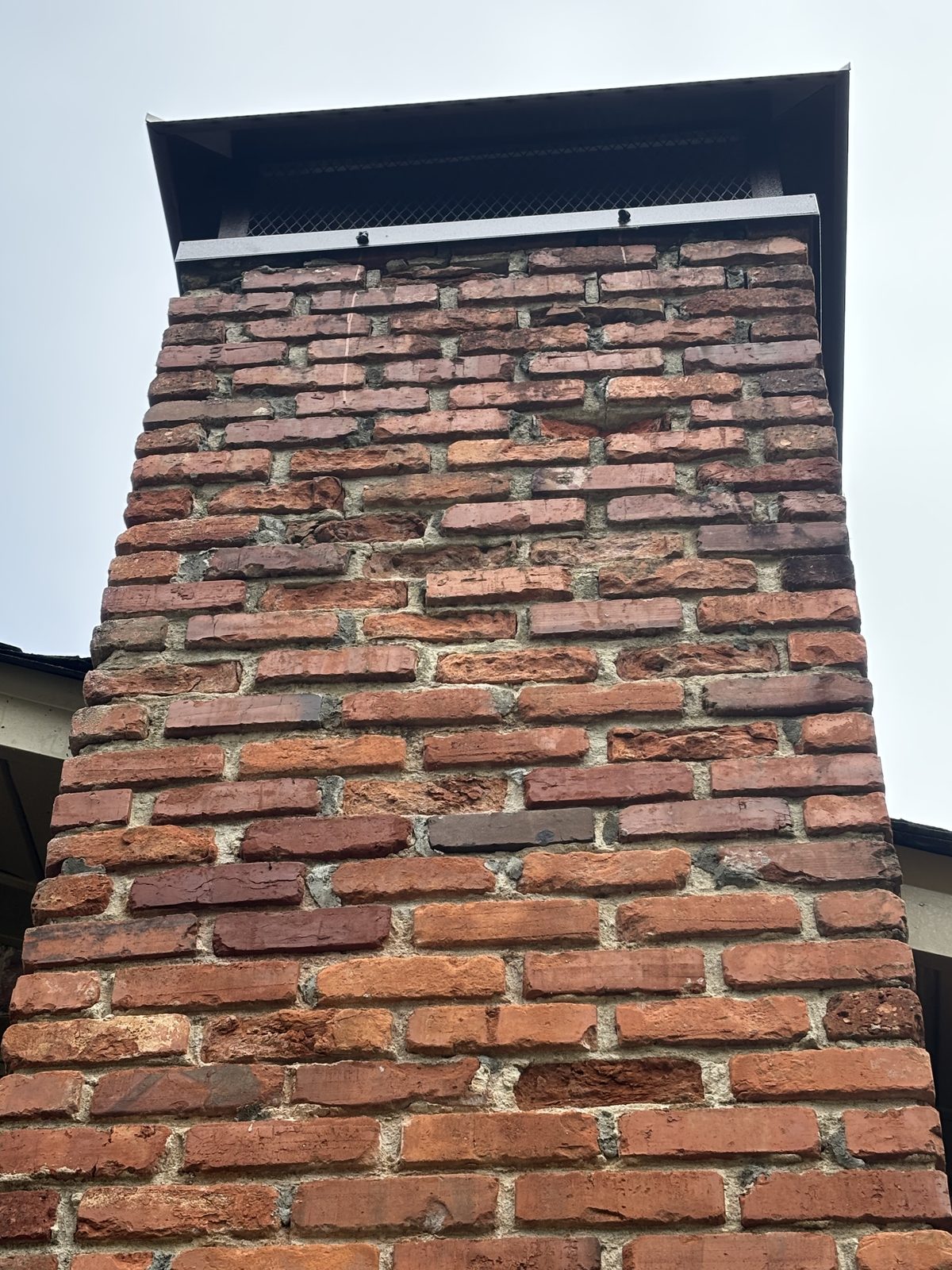 Clean brick chimney after soft wash and water repellent